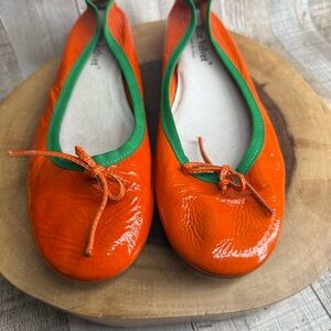 Vibrant Orange Flats with Green Trim